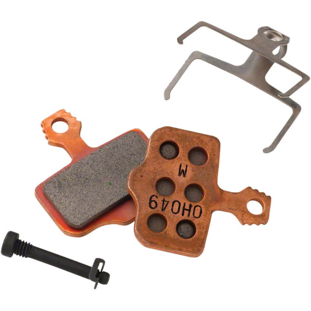 Copper colored sintered SRAM eTap AXS Level Disc Brake Pads with spring, clip and pin against a white background